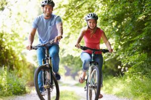 Couple biking through Davidson, NC