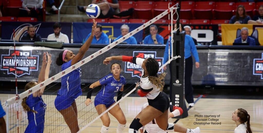 dvi-blog-dc-volleyball | Davidson Village Inn Davidson College volleyball players battling at the net during the A10 Championship match.