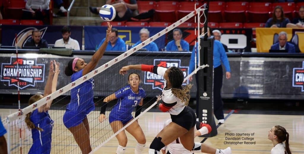 dvi-blog-dc-womens-volleyball | Davidson Village Inn Davidson College volleyball players battling at the net during the A10 Championship match.