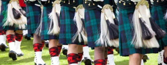 Marching band with bagpipes and kilts