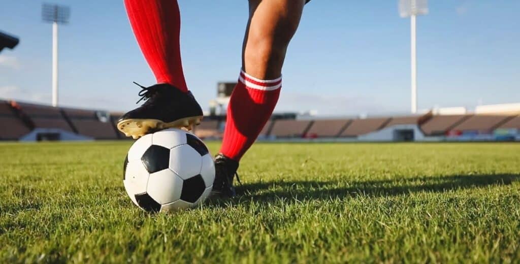 Soccer player controlling the ball during a match, one of the exciting Davidson College fall sports