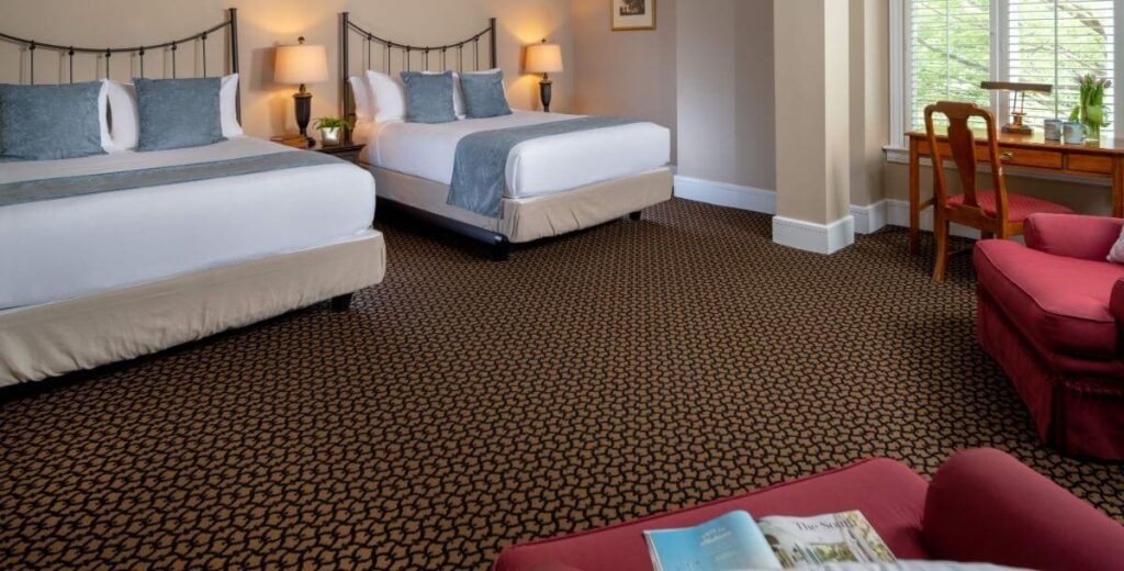 A spacious Family Suite with two beds at Davidson Village Inn in Davidson, NC.