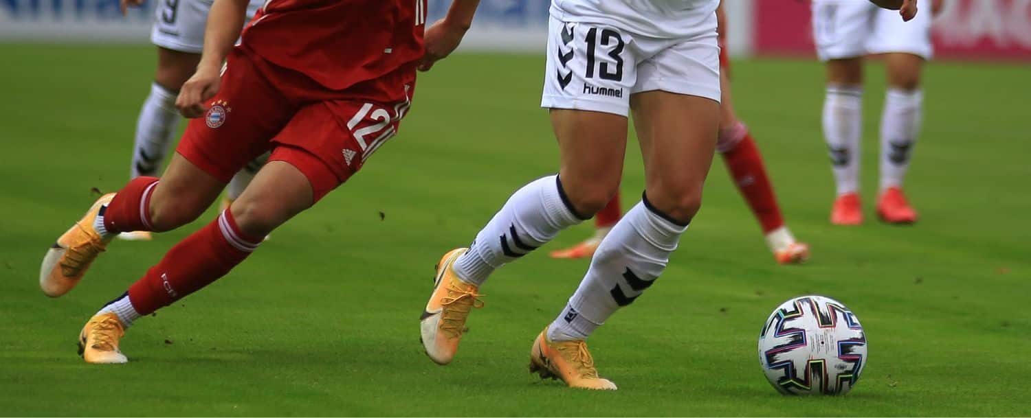 Women playing in a soccer game