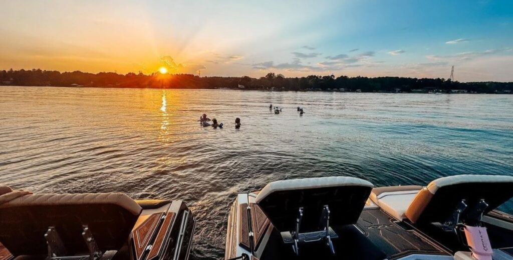 Boats rest on Lake Norman at sunset, near Davidson Village Inn in Davidson, NC.