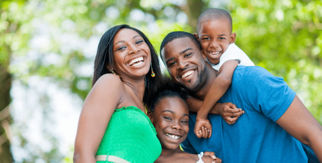 Smiling family enjoying a summer day outdoors near Davidson NC