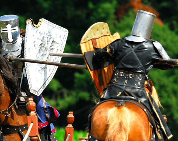 Two knights jousting on horseback